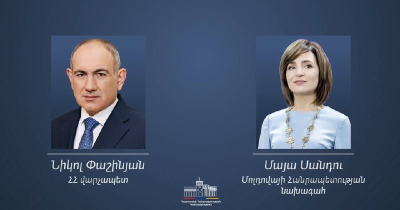 Никол Пашинян и Майя Санду, политические лидеры Армении и Молдовы, на фоне флагов стран